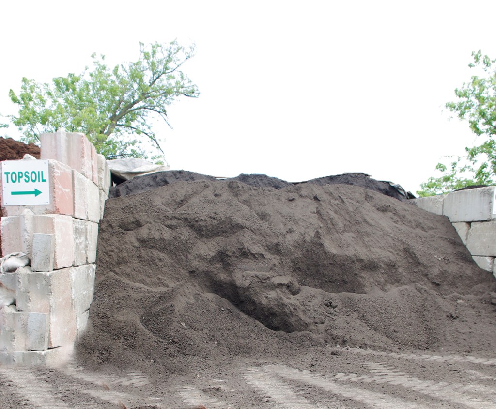 Bulk topsoil in a labeled bin at Des Plaines Material & Supply